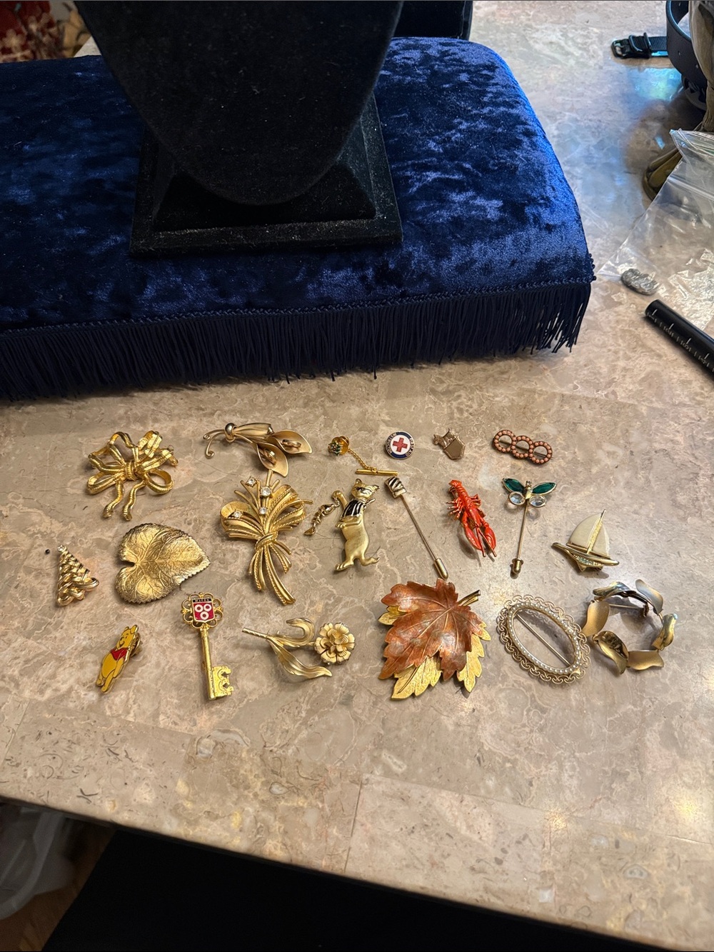 Vintage lot of 20 unique, gold tone brooches some marked from 1950s to 1990s
